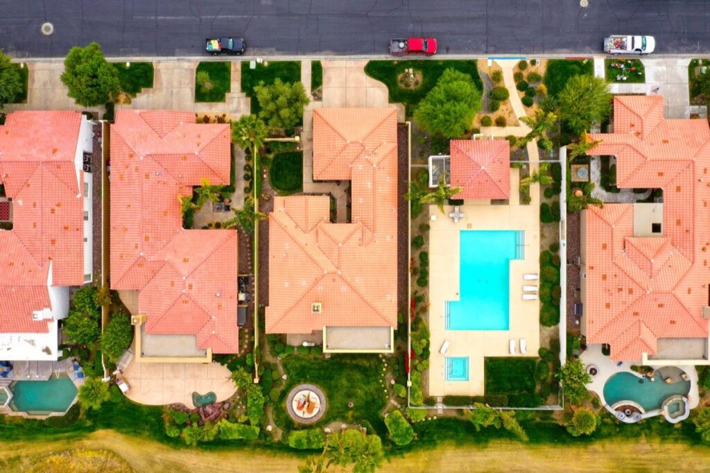 Aerial view of Las Vegas valley homes with pools and tile roofs