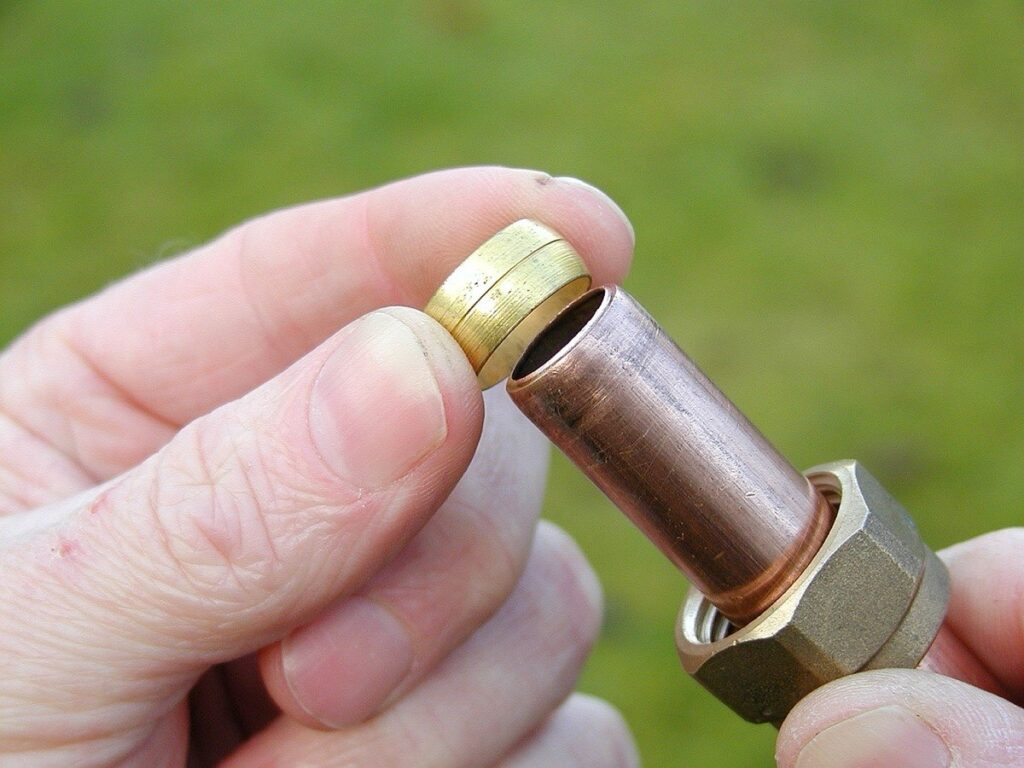 Copper water pipe joined to a brass compression fitting